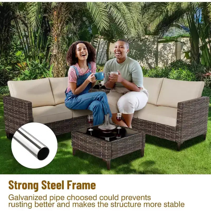 Ensemble de meubles de patio Acekool 4 pièces en osier PE noir avec table de rangement, canapé sectionnel, plateau en verre et coussins beiges pour espaces extérieurs